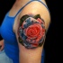 Realistic red rose tattoo on shoulder