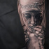 Realistic religious theme sleeve tattoo