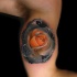 Realistic rose tattoo on biceps