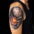 Realistic skull in space tattoo on shoulder