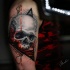 Realistic skull tattoo on shoulder