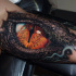 Realistic snake eye tattoo on arm