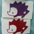 Red and purple hedgehogs with heart print tattoo design