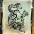 Screaming snake and skull with arrows on eye hole tattoo design