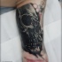 Tatuagem de caveira no braço