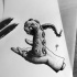 Strange dotwork human hand keeping an octopus tentacles tattoo design