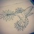 Super uncolored hummingbird flying on mandala flowers background tattoo design