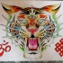 Three-eyed crying tiger with red buddhist symbols tattoo design