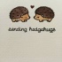 Tiny kissing hedgehog couple with lettering tattoo design