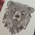 Tired grey-ink ornamented grizzly head tattoo design