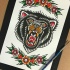 Traditional colorful old school bear head with floral frame tattoo design