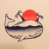 Traditional whale with beach view inside tattoo design