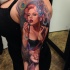 New school style colored shoulder tattoo of seductive woman with flowers