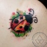 Watercolor ladybug tattoo