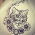 Winking gem-decorated cat portrait in flowered frame tattoo design