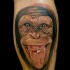Tatuaje  de rostro del chimpancé divertido