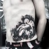 Abstract style black and white waist tattoo of sad angel