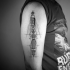Abstract style black ink shoulder tattoo of mechanisms