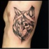 Abstract style black ink side tattoo of wolf head