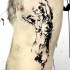 Abstract style black ink side tattoo of naked woman