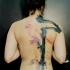 Abstract style black ink whole back tattoo of mysterious symbol