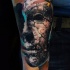 Abstract style colored arm tattoo of corrupted mask