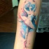 Abstract style colored forearm tattoo of ballet dancer