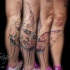 Abstract style colored leg tattoo of kissing couple