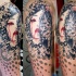 Abstract style colored shoulder tattoo of woman portrait with various ornaments
