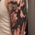 Abstract style colored shoulder tattoo of conductor