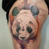 Abstract style colored thigh tattoo of panda bear