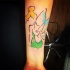 Abstract style Tinkerbell shaped forearm tattoo