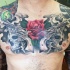 Accurate looking detailed chest tattoo of revolver pistols and skulls