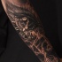 accurato dipinto particolare orologio a forma occhio nero  tatuaggio avambraccio