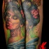 Accurate painted colored zombie Asian woman portrait tattoo on forearm