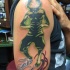 Alien like colored shoulder tattoo of creepy monster