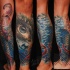 Amazing combined colored forearm tattoo of woman eye and sharks