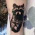 Amazing looking black and white tattoo of cute raccoon