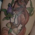 Tatuaje  de ardilla parda con bellotas