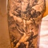 angelo e demone combatendo tatuaggio su spalla