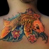 Asian style golden carp fish in water waves colored floral tattoo on upper back
