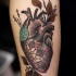 eccezionale cuore colorato avambraccio tatuaggio