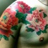 Awesome detailed colorful flowers tattoo on shoulder