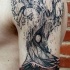eccezionale idea di albero tatuaggio a mezza manica da David Hale