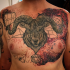 Awesome looking colored thigh tattoo of goat head with geometrical figures
