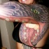incredibile testa serpente  tatuaggio sul braccio