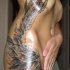 Beautiful angel wing tattoo on ribs for girls