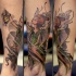 Beautiful colored illustrative style leg tattoo of fantasy Tinkerbell
