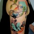 Beautiful colored shoulder tattoo of woman face with birds