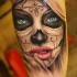 Tatuaje en el antebrazo, santa muerte,chica hermosa con ojos azules